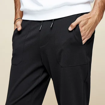 KUEGOU Mužov bežné nohavice mužov slim elastický úplet nohavice Black fashion lúč nohy športové nohavice KK-2969